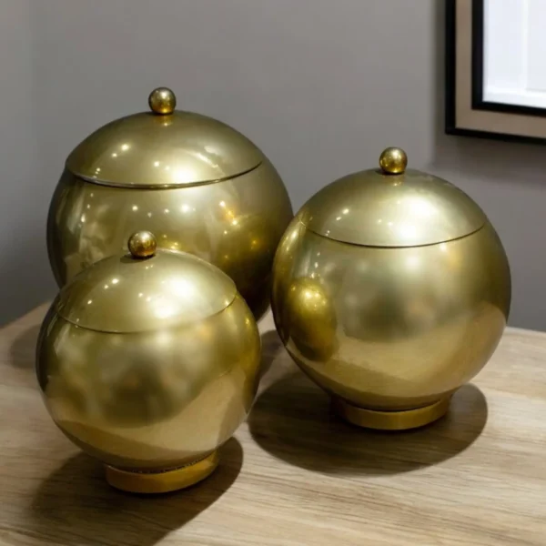 Set of Three Gold Metal Decorative Lidded Canisters
